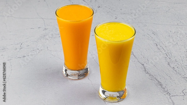 Fototapeta a luscious mango smoothie and a creamy mango lassi and organge juice