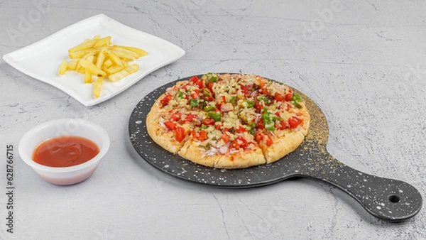 Fototapeta delicious pizza on pan with fries and sauce on texture white background