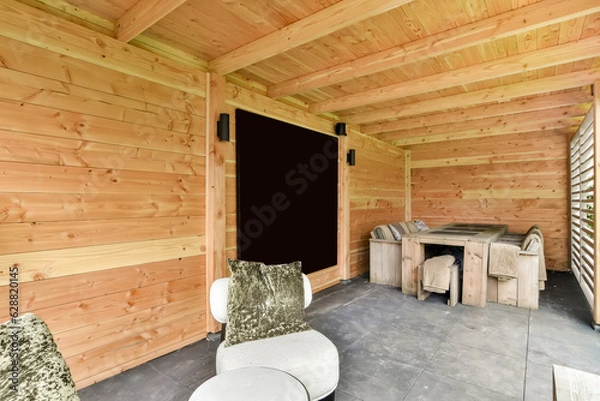 Obraz a living room with wood paneled walls and white furniture on the floor, in front of a blackboard wall