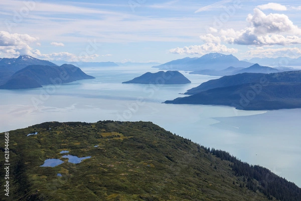 Obraz Aerial photo of a mountain peak near Juneau, Alaska with Gastineau Channel and Stephens passage in the background.
