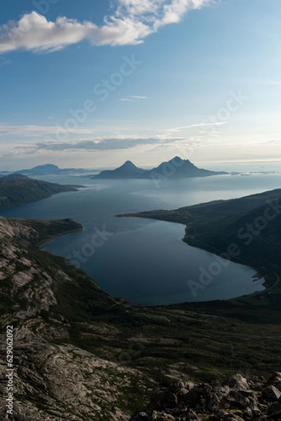 Fototapeta Afternoon view from Smaltinden, Luröy, Helgeland, NordNorge. View over Norwegian island of Tomma, across sjona. Mountains on islands in Norway. Tower of rocks in the foreground. Beautiful Norway hike.