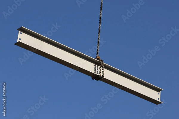 Obraz Steel girder swinging from a crane on a construction site