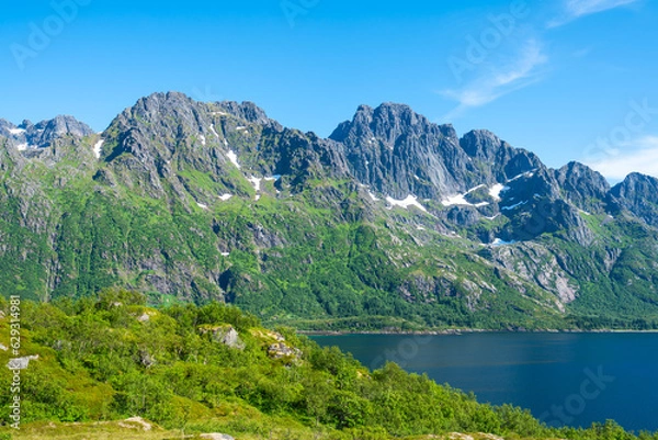 Fototapeta Amazing view at Lofoten islands Austvagoya, Austnesfjorden, Norway. Fjord summer landscape travelers rest area. Nordland, Coastline sea, ocean with mountains in background