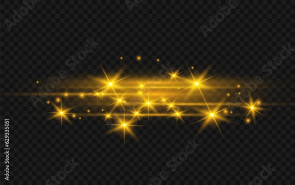 Fototapeta The dust sparks and golden stars shine with special light. Vector sparkles on a transparent background. Christmas light effect. Sparkling magical dust particles.