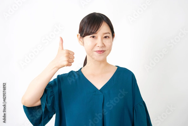 Fototapeta グッドポーズする女性　白背景