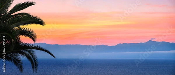 Fototapeta Banner of sunset over sea in Corfu island in Greece. Summer time and mood. Beautiful vibrant evening. Copy space.