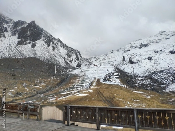 Obraz Mountains with snow in alps cloudy sky