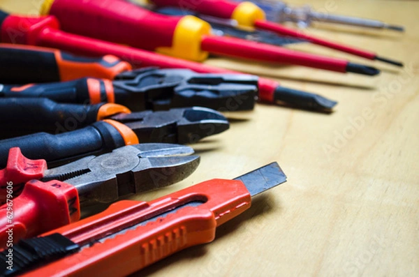 Fototapeta Different types of tools screwdrivers, pliers, nippers.