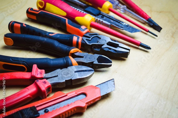 Fototapeta Different types of tools screwdrivers, pliers, nippers.
