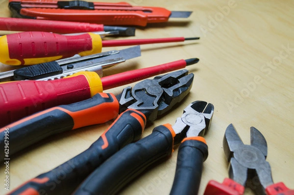 Fototapeta Different types of tools screwdrivers, pliers, nippers.