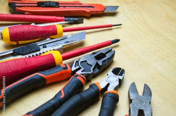 Fototapeta Different types of tools screwdrivers, pliers, nippers.