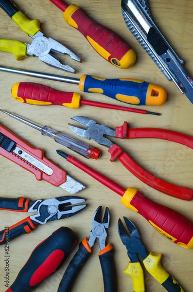 Fototapeta Different types of tools screwdrivers, pliers, nippers.