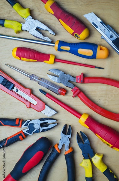 Fototapeta Different types of tools screwdrivers, pliers, nippers.