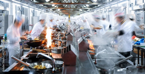 Obraz Motion chefs working in Chinese restaurant kitchen