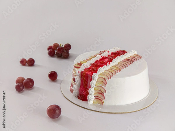 Obraz Delicious grape fruit cake on white surface