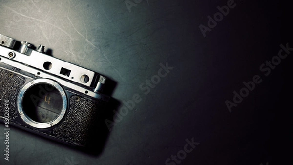 Obraz old film camera on a black background