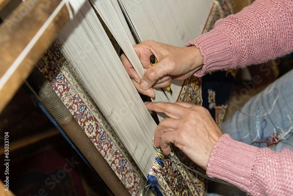 Fototapeta Making a turkish carpet