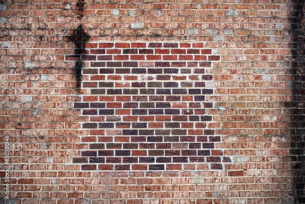 Obraz brick wall, old red brick background with new brick patch.