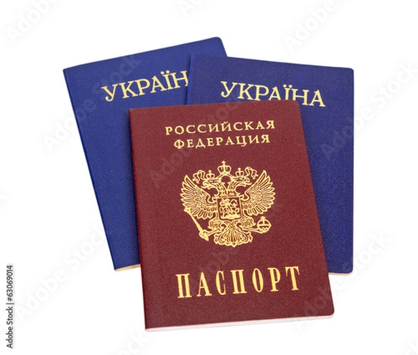 Obraz Ukrainian and Russian passports isolated on white background