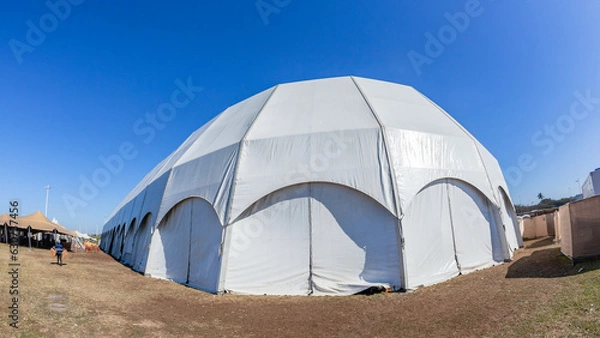 Obraz Large Tent Portable Dome White Canvas Structure Entertainment Structure Close-up Blue Sky. 