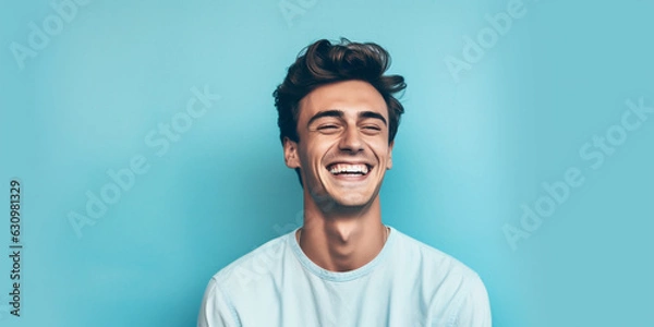 Obraz Happy young man on a solid background