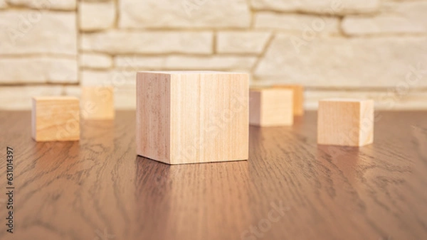 Fototapeta wooden blocks on wooden table, close up. space for text