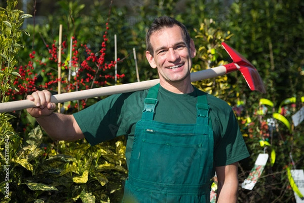 Obraz Farmer or gardener posing with shovel in garden