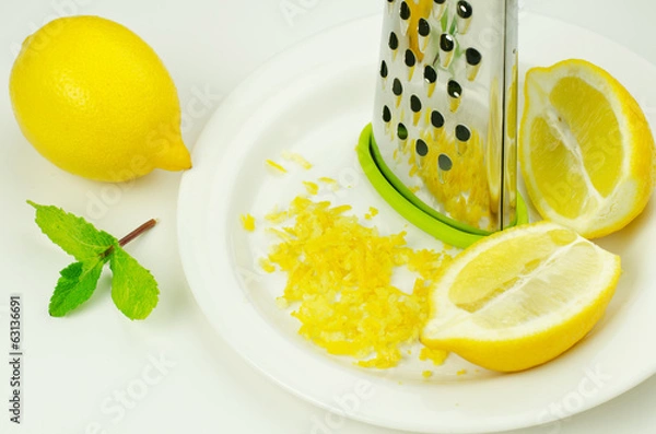 Fototapeta Lemon and lemon zest with grater