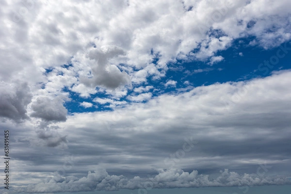 Fototapeta Blue sky with clouds background overlay. Ideal for sky replacement