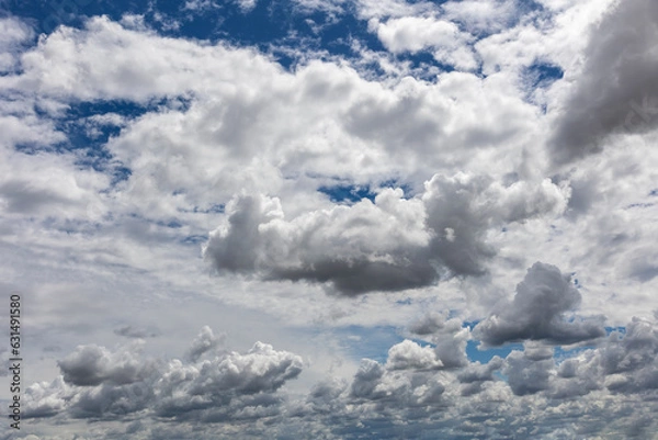 Fototapeta Blue sky with clouds background overlay. Ideal for sky replacement