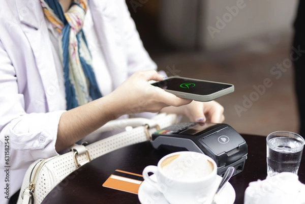 Fototapeta Payment with smartphone. Check symbol on screen.