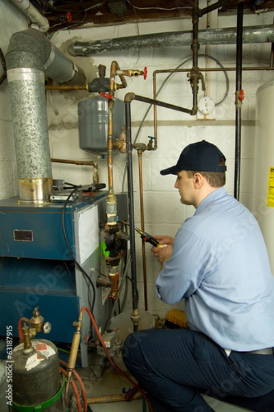 Obraz Plumber fixing gas furnace