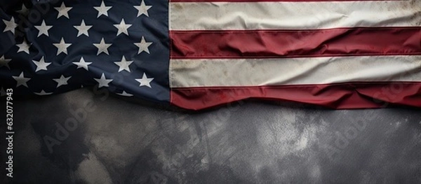 Fototapeta A view from above showing the United States flag, representing Memorial Day or Independence Day. The flag is displayed on a concrete board background, with space for text.