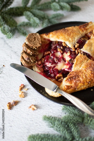Obraz Baked brie cheese and cranberry puff pastry. Homemade puff pastry baking, sweet-savory taste, gourmet appetizer.