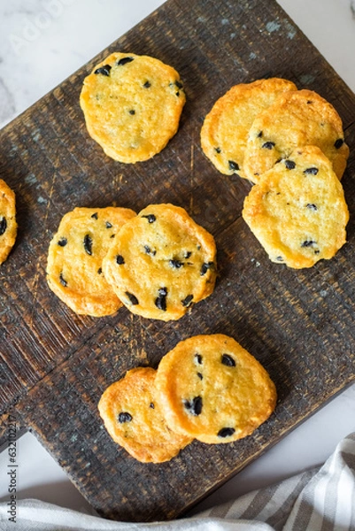 Obraz Italian style round shortbread cookies with black olives and Parmesan cheese