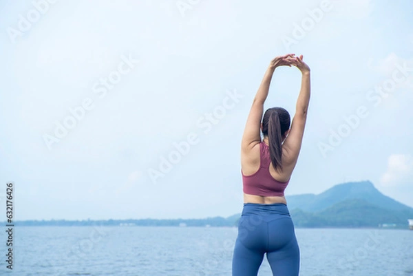 Fototapeta The asian woman do yoga in holiday time, on modern concept and healthy. Nature background with exercise and nature, female happiness concept