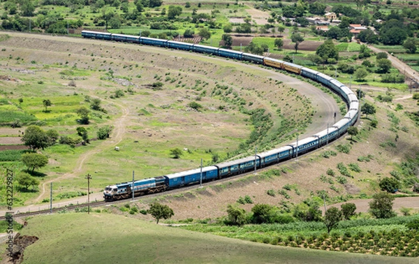 Obraz Express passenger train passing over a huge curve in a place named Daundaj, Maharashtra, India