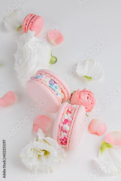 Obraz Top view Set Beautiful colorful French macaroons and flowers. Spring Flat lay white background