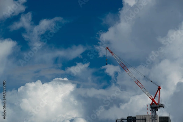 Obraz ビルの上の建築用の大型クレーン