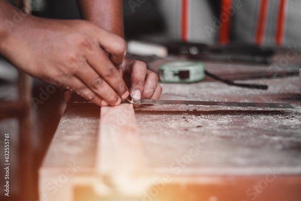 Fototapeta Carpenter working with equipment on wooden table, And measurement of a wooden plank