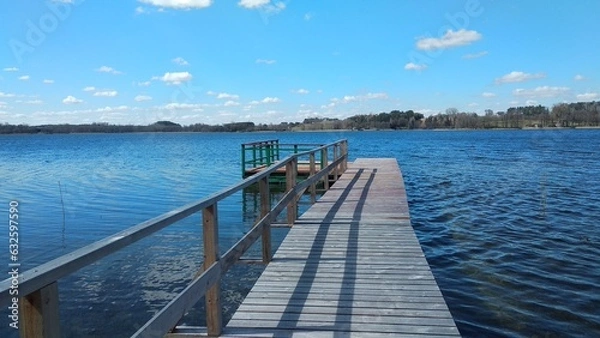Fototapeta A wooden footbridge and a platform on a lake
