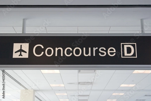 Fototapeta Direction signs in an airport terminal for travelers