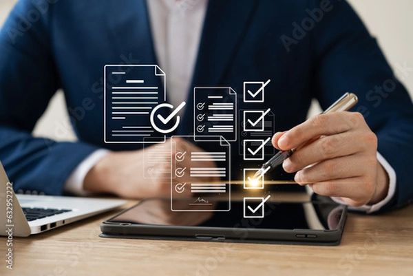 Fototapeta Business performance monitoring concept, businessman using tablet and laptop Online survey filling out, digital form checklist, blue background.