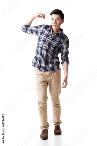 Fototapeta Asian young guy carry or take something