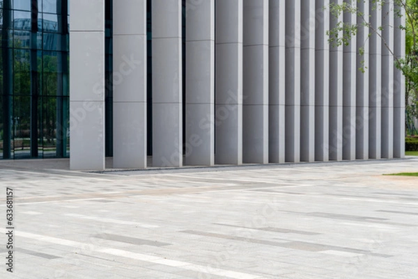 Fototapeta empty concrete floor in front of modern buildings in the downtown street.
