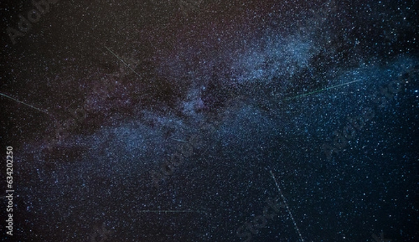 Fototapeta TUHINJ VALLEY, SLOVENIA - AUGUST 12, 2023: Perseid meteor shower, seen on the evening sky from Tuhinj valley in Slovenia