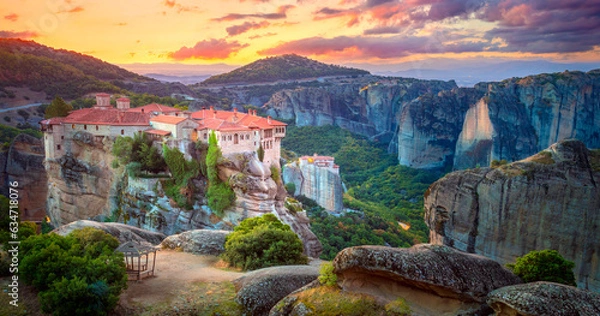 Fototapeta Panoramic view of Meteora. Greece, Meteora Monasteries. Panoramic view of the Holy Monastery of Varlaam, located on the edge of a high cliff. Beautiful sunrise.