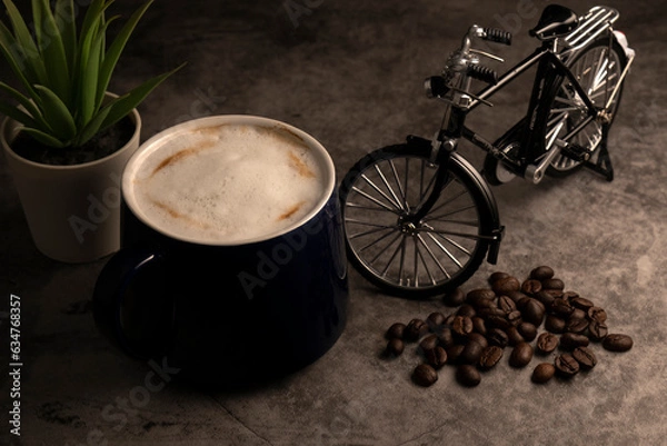 Fototapeta Favorite cup of coffee with a model bicycle