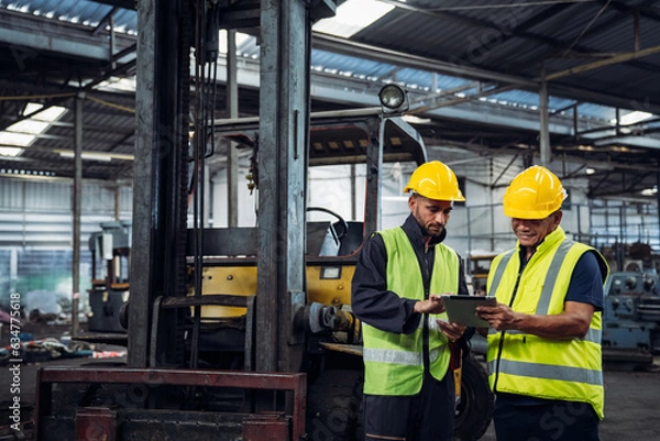 Fototapeta Mechanical technicians are maintaining the engine. Engineer checking Material or Machine on Plant. Workers Factory check up machine at factory site.