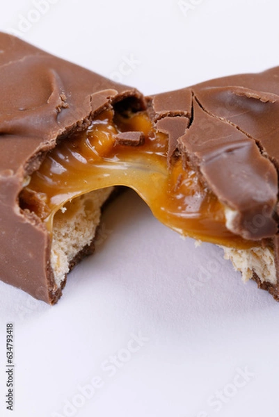Obraz Sweet chocolate bar broken into two pieces. Macro photo.